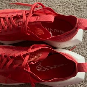 Nike Vista Lite/Mesh material. Never worn outside of home. Size 10